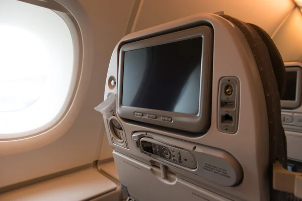 Plane seat with TV screen — Stock Photo, Image