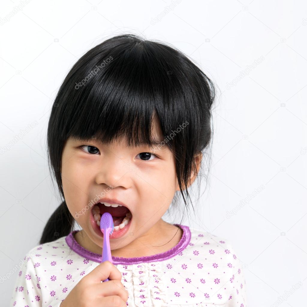 Child brushing teeth