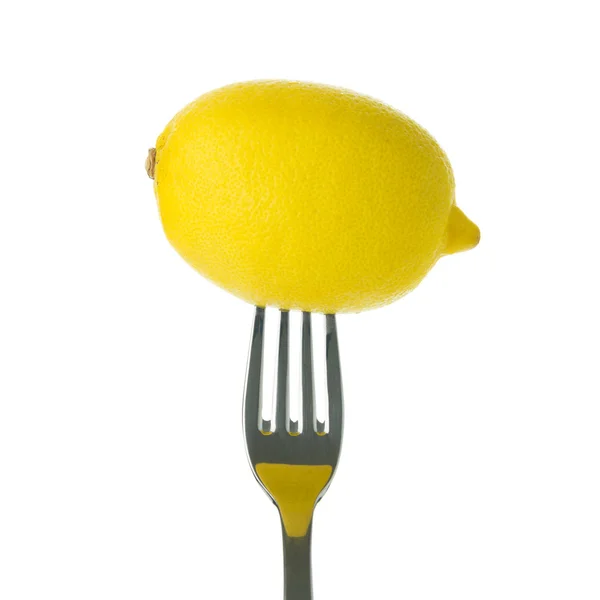 Целый лимон на вилке — стоковое фото