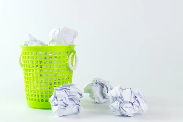 Trash bin and crumpled paper balls Stock Photo