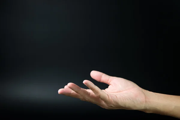 Mano abierta en fondo oscuro — Foto de Stock