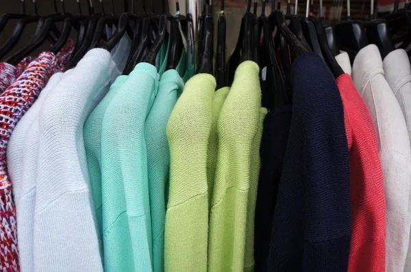 Pullovers on hangers. — Stock Photo, Image