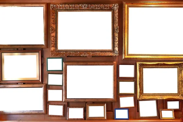 Blank picture frames on a wall gallery — Stock Photo, Image