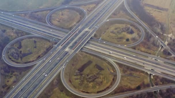 Freeway cloverleaf interchange drone view with some snowing — Stock Video