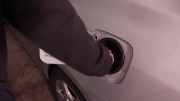 Fuel station nozzle filling car tank — Stock Video