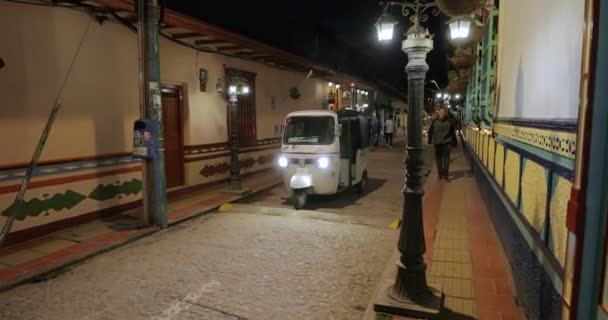 Guatape Colombia busy street view at night — Stock Video
