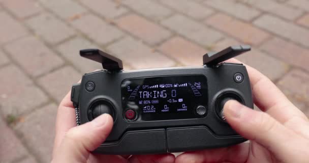 Drone controller remote held in hand — Stock Video