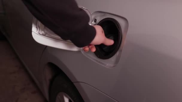 Fuel station nozzle filling car tank — Stock Video