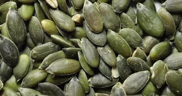 Pumpkin seeds pile spinning — Video Stock