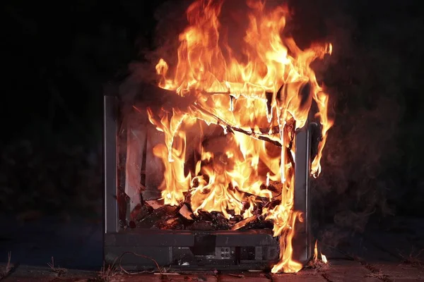 TV burning with broken screen — Stock Photo, Image