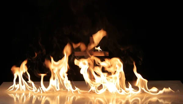 Fire around a burning cross symbol — Stock Photo, Image