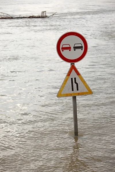 Flooded street with traffic sign — Stock Photo, Image