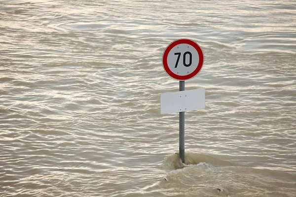 Flooded street with sign — Stock Photo, Image