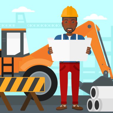 Bir plan tutan mühendisi.