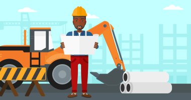 Bir plan tutan mühendisi.