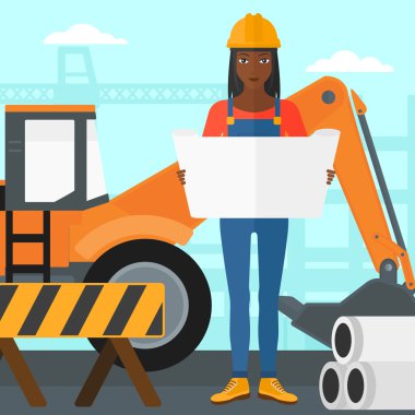 Bir plan tutan mühendisi.