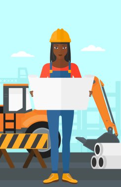 Bir plan tutan mühendisi.