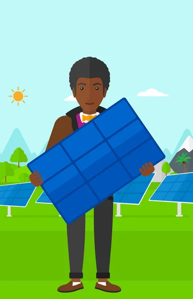 Mann mit Solarpaneel. — Stockvektor