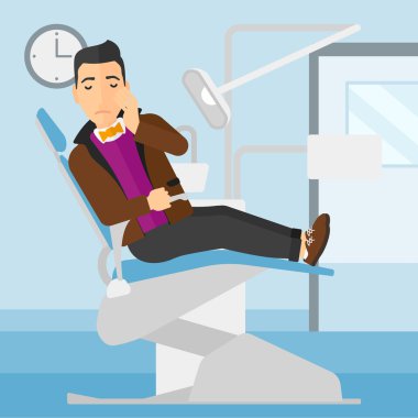 Adam diş sandalyede acı.