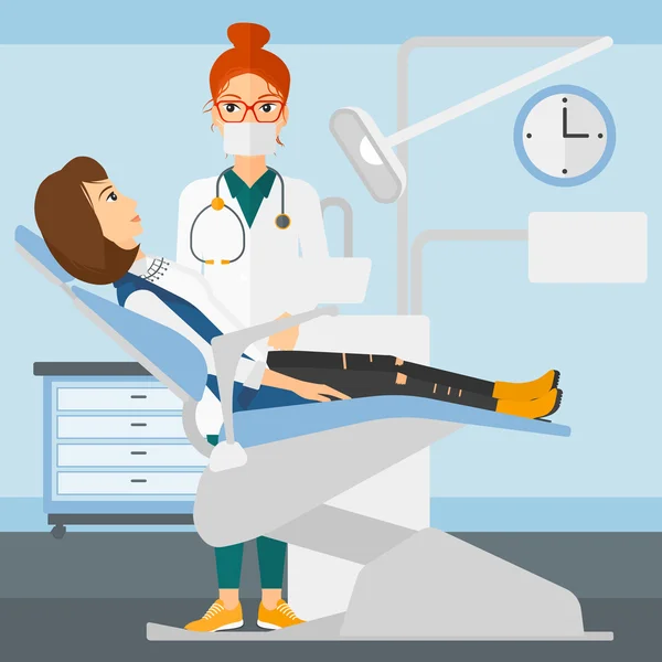 Dentista e donna sulla sedia del dentista . — Vettoriale Stock