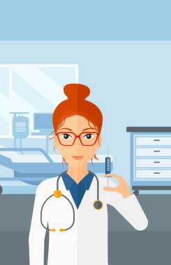 Doktor hastane koğuşunda şırınga.