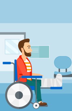 Tekerlekli sandalyede oturan hasta.