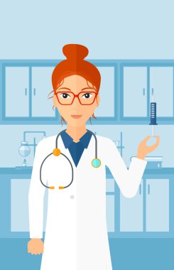 Doctor with syringe in laboratory.