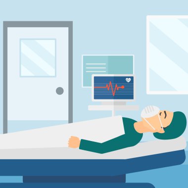 Patient lying in hospital  bed with heart monitor.
