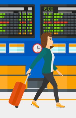 Kadın bavulla yürüyor..