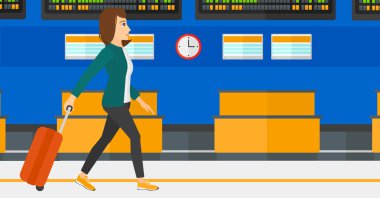 Kadın bavulla yürüyor..