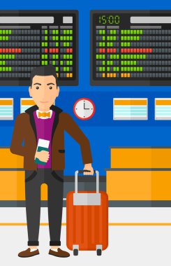 Man standing with suitcase and holding ticket.