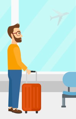 adam havaalanında bavul ile.