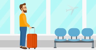 adam havaalanında bavul ile.