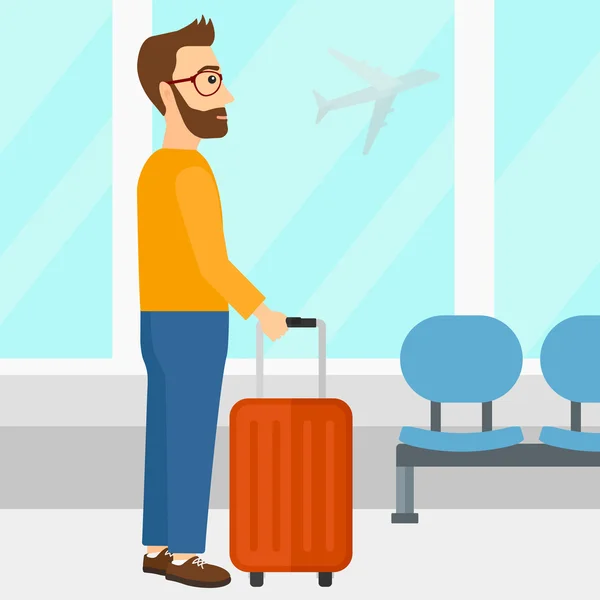 Man på flygplatsen med resväska. — Stock vektor