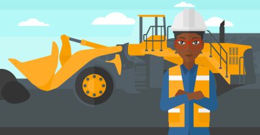 Madenci arka plan üzerinde madencilik ekipmanları ile.