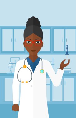 Doctor with syringe in laboratory.