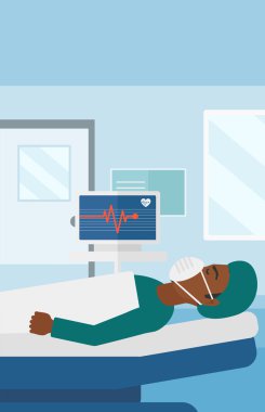 Patient lying in hospital bed with heart monitor.