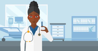 Doktor hastane koğuşunda şırınga.