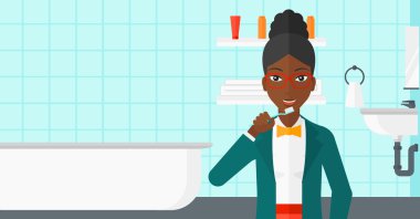 Dişlerini fırçalayan kadın.