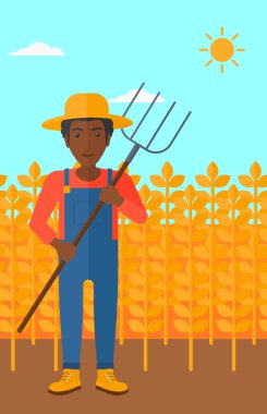 Çiftçi dirgen ile.