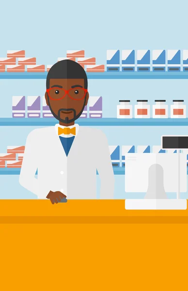 Pharmacist at counter with computer monitor. — Stock vektor