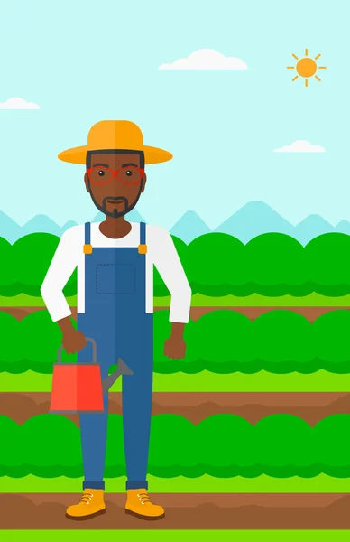 Agriculteur avec arrosoir. — Image vectorielle