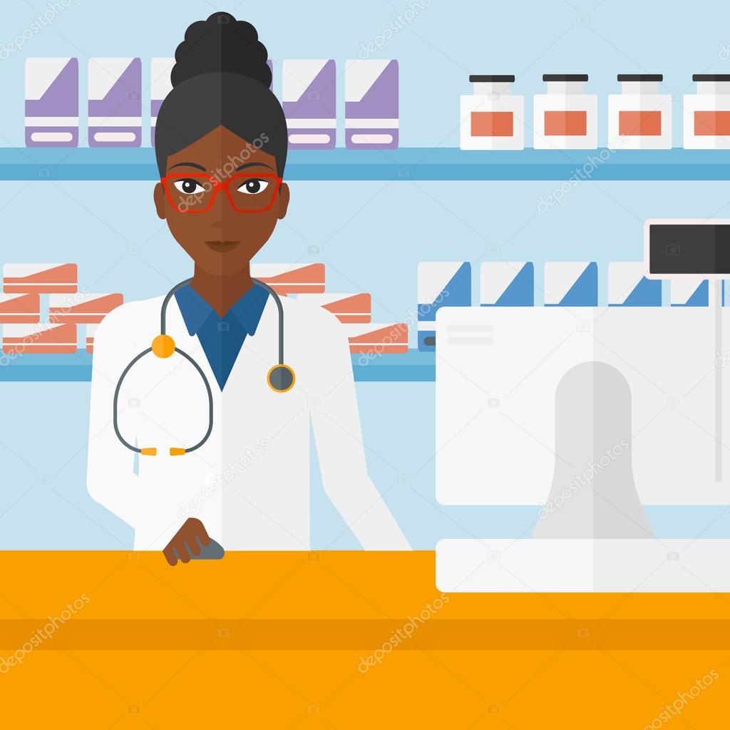 Pharmacist at counter with computer monitor.