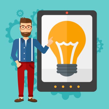 Man pointing at tablet computer with light bulb on screen.