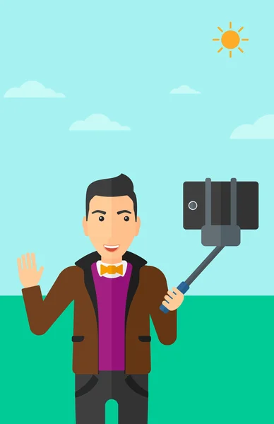 Muž tvořící selfie. — Stockový vektor
