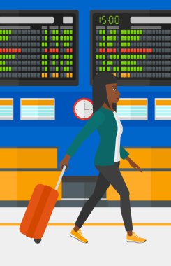 Kadın bavulla yürüyor..