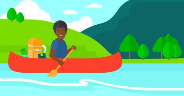 Man canoeing on the river.
