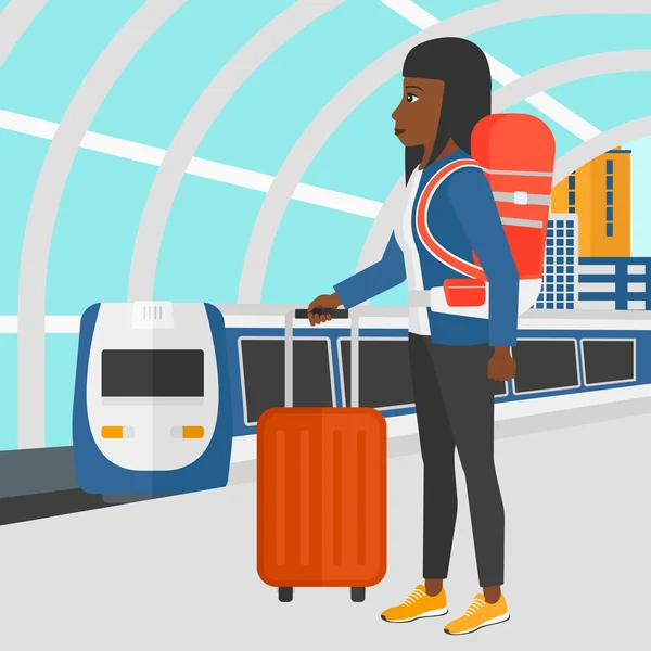 Woman with suitcase on wheels and briefcase. — Stockvector