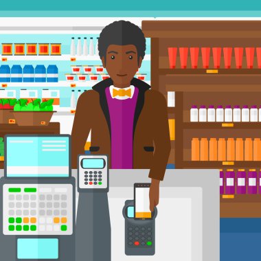 Customer paying with his smartphone using terminal.