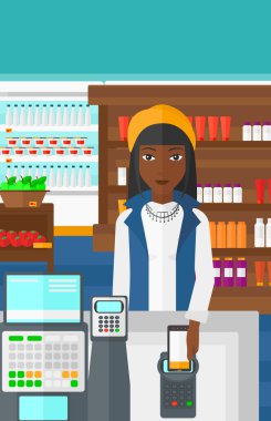 Customer paying with smartphone using terminal.